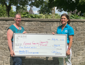 Gayle Ecker, Director at Equine Guelph University of Guelph, accepting a donation towards Equine welfare from event organizer, Bridget Ryan